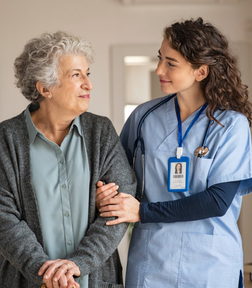 caregiver and senior woman smiling