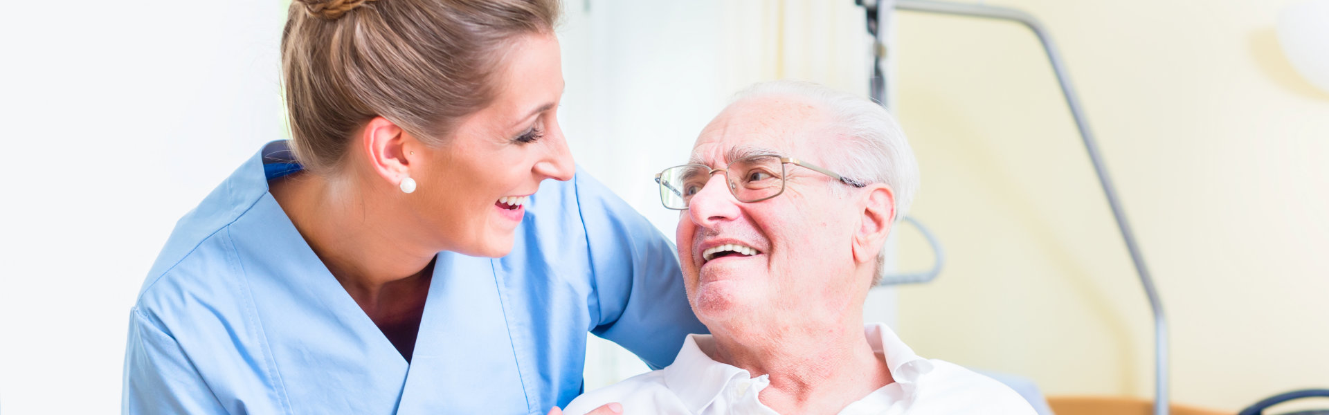 caregiver and senior smiling